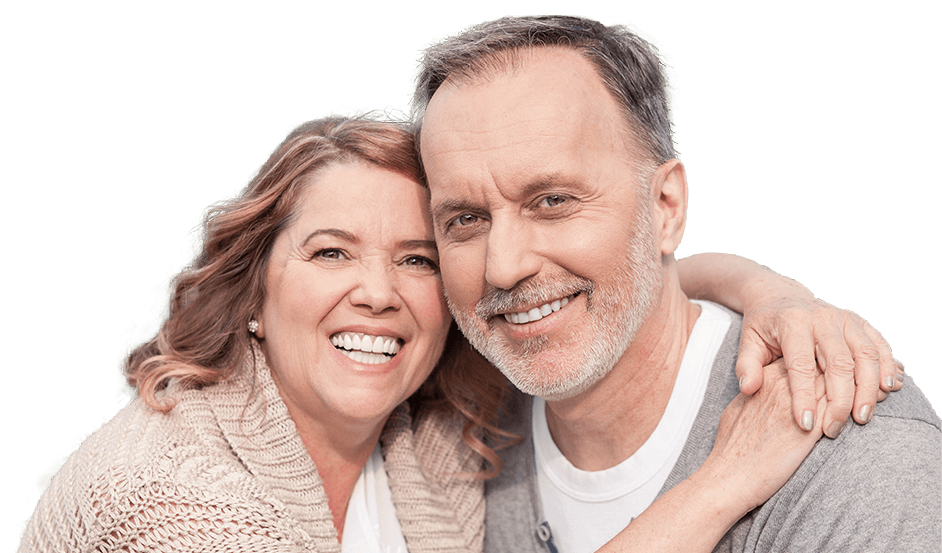 Older man and woman smiling and holding each other
